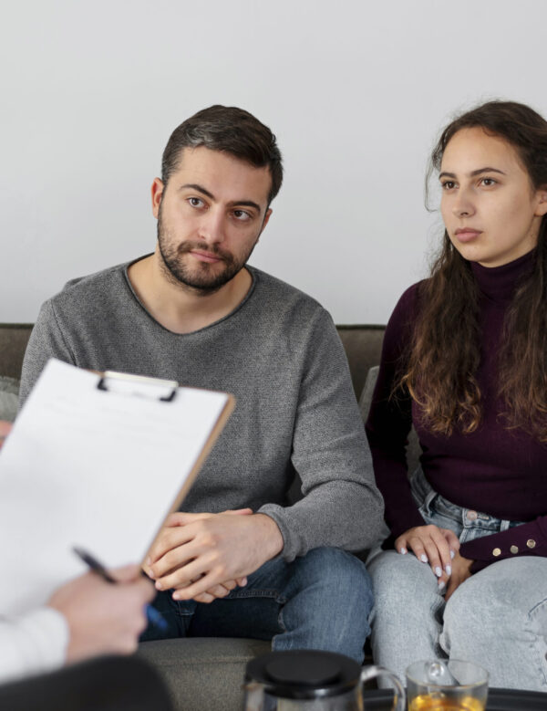 close-up-people-discussing-with-therapist